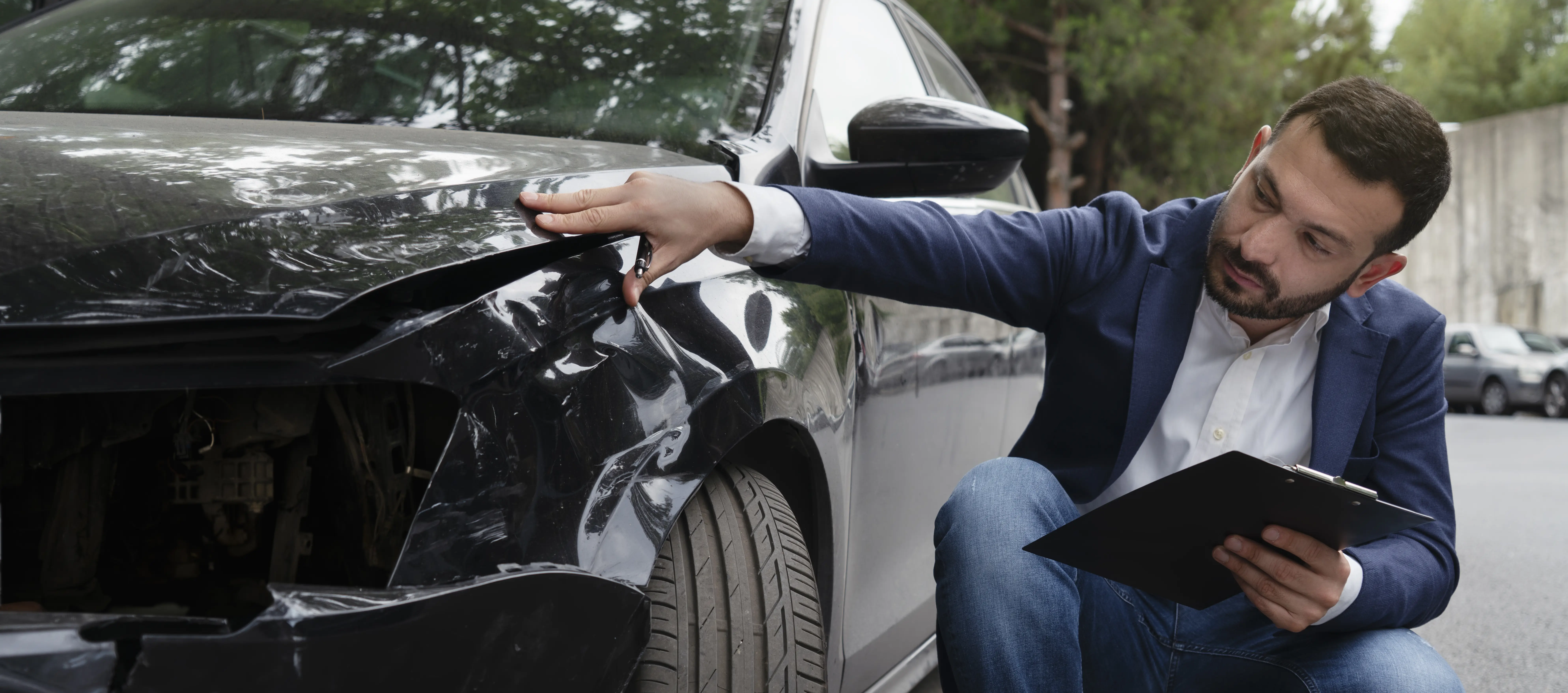Inspecting car damage after a crash